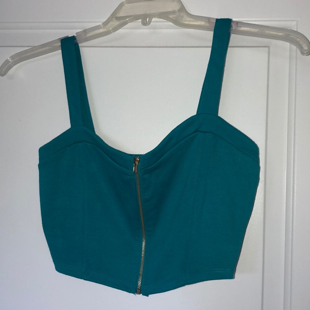 Turquoise crop top with gold accent zipper